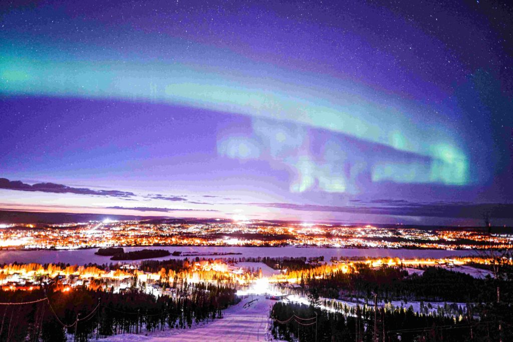 Arctic Road Trips, Northern Lights above Rovaniemi, Lapland Finland, Photo Luisa Schaffner